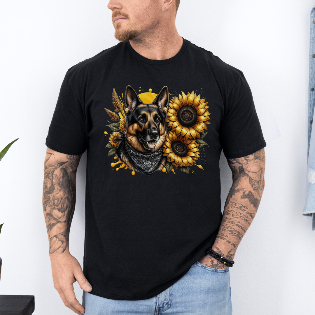 A man wearing a black short-sleeve t-shirt with a graphic print of a German Shepherd dog surrounded by yellow sunflowers, paired with light blue jeans. Grab your tee from Coffee and Moo NZ.