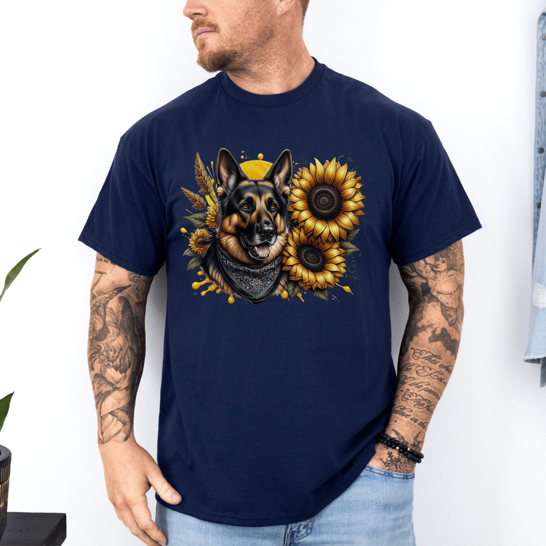 A man wearing a navy short-sleeve t-shirt with a graphic print of a German Shepherd dog surrounded by yellow sunflowers, paired with light blue jeans. Grab your tee from Coffee and Moo NZ.