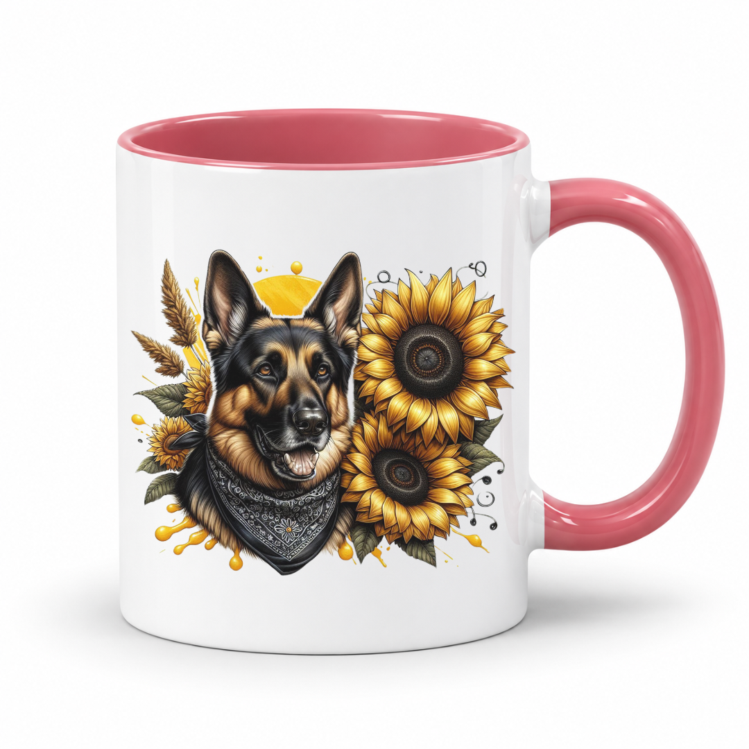 A white ceramic mug with a pink interior and handle, featuring a printed illustration of a German Shepherd dog wearing a bandana, surrounded by yellow sunflowers and wheat on a white background. Grab your mug from Coffee and Moo NZ.