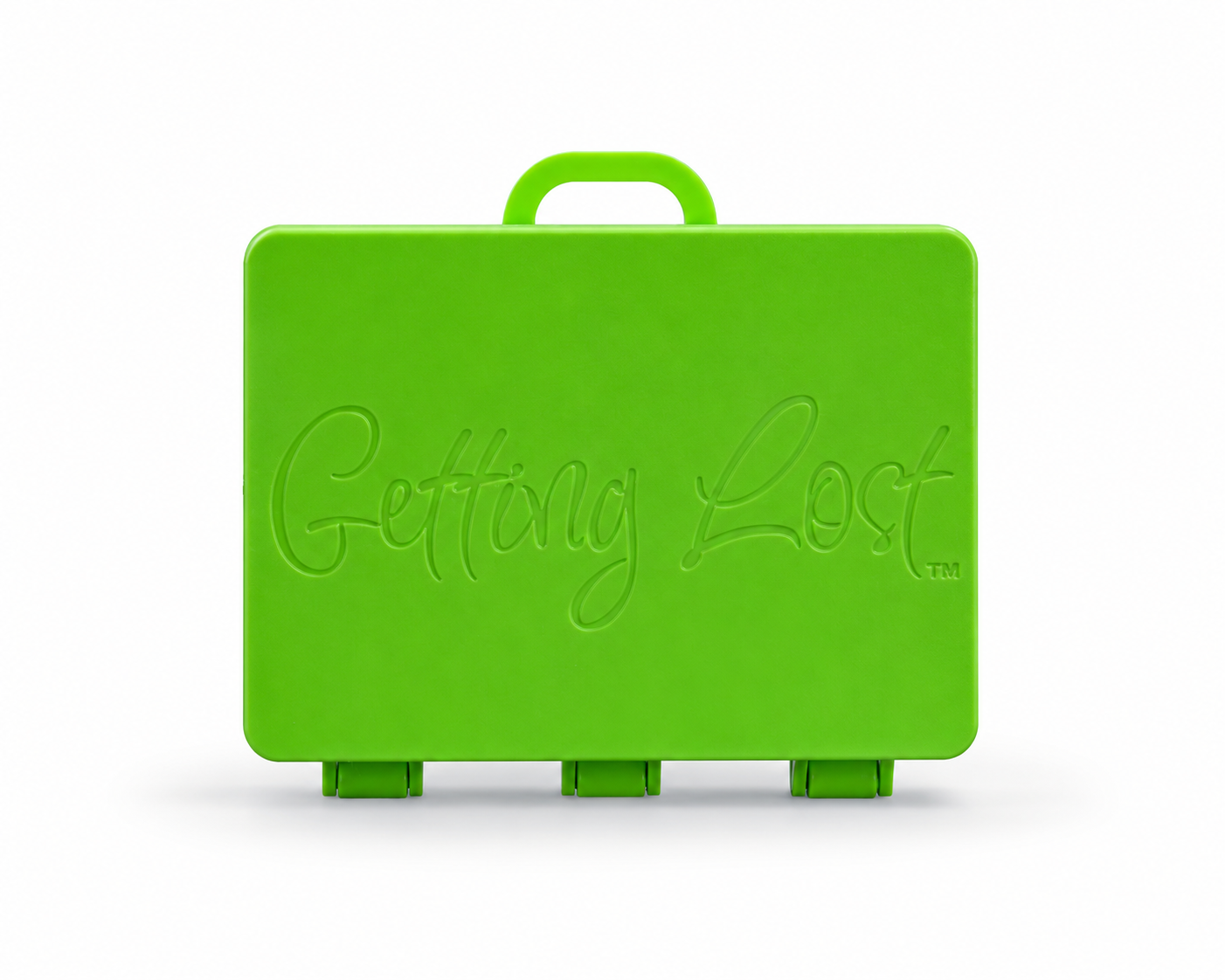 A green rectangular carrying case with a top handle, featuring the words 'Getting Lost' embossed on the front, set against a plain white background. For the Getting lost card game. Purchase from Coffee and Moo