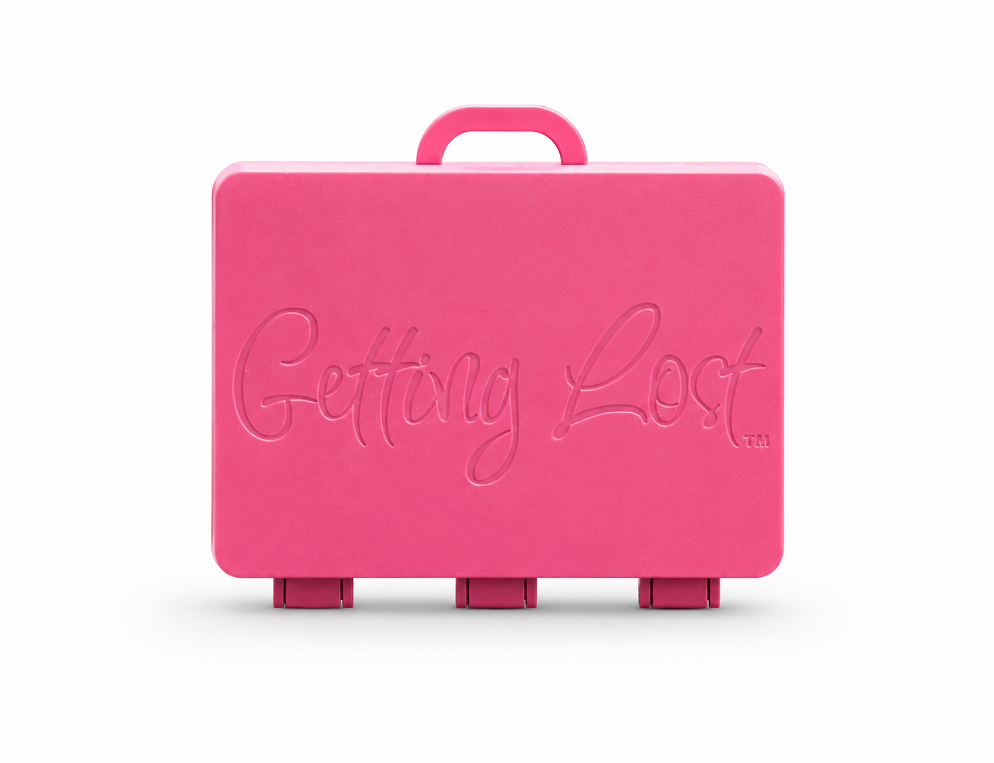 A pink rectangular carrying case with a top handle, featuring the words 'Getting Lost' embossed on the front, set against a plain white background. For the Getting lost card game. Purchase from Coffee and Moo