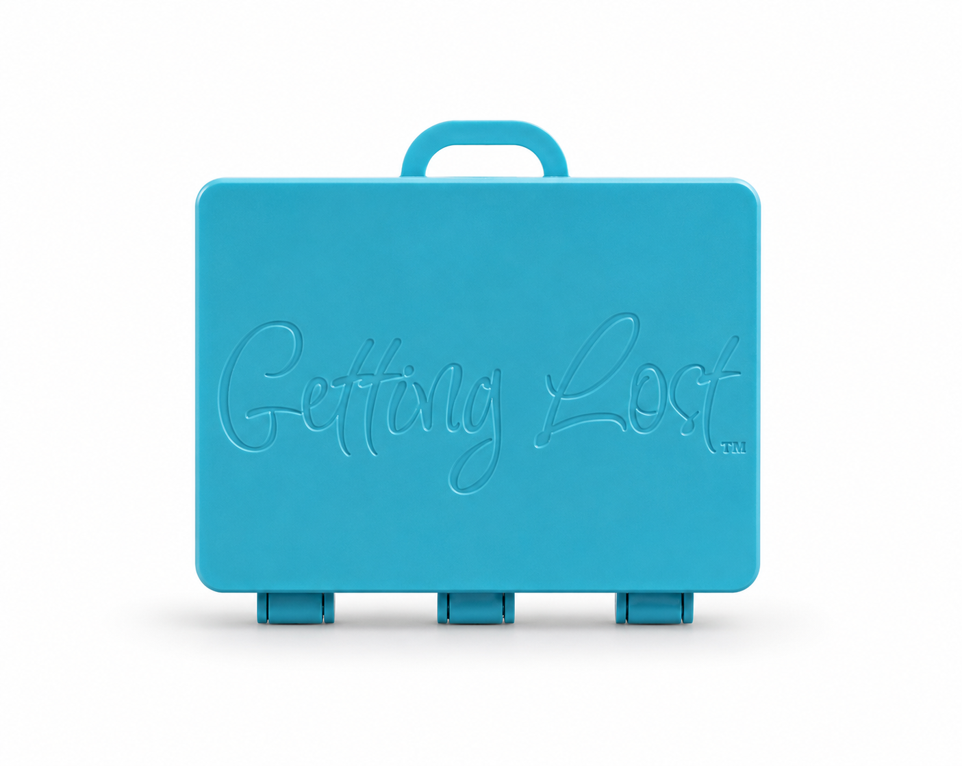 A turquoise rectangular carrying case with a top handle, featuring the words 'Getting Lost' embossed on the front, set against a plain white background. For the Getting lost card game. Purchase from Coffee and Moo