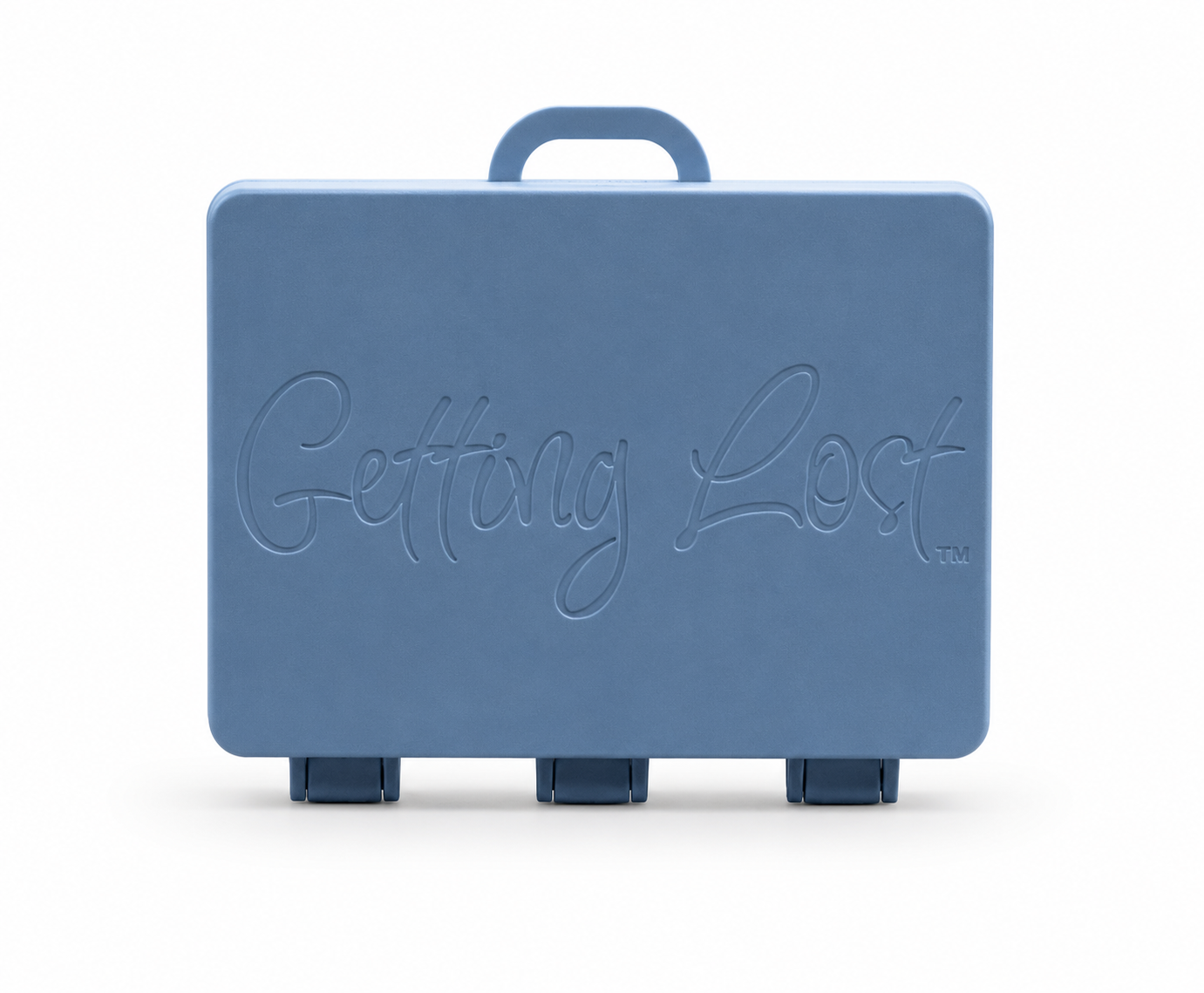 A twighlight blue rectangular carrying case with a top handle, featuring the words 'Getting Lost' embossed on the front, set against a plain white background. For the Getting lost card game. Purchase from Coffee and Moo