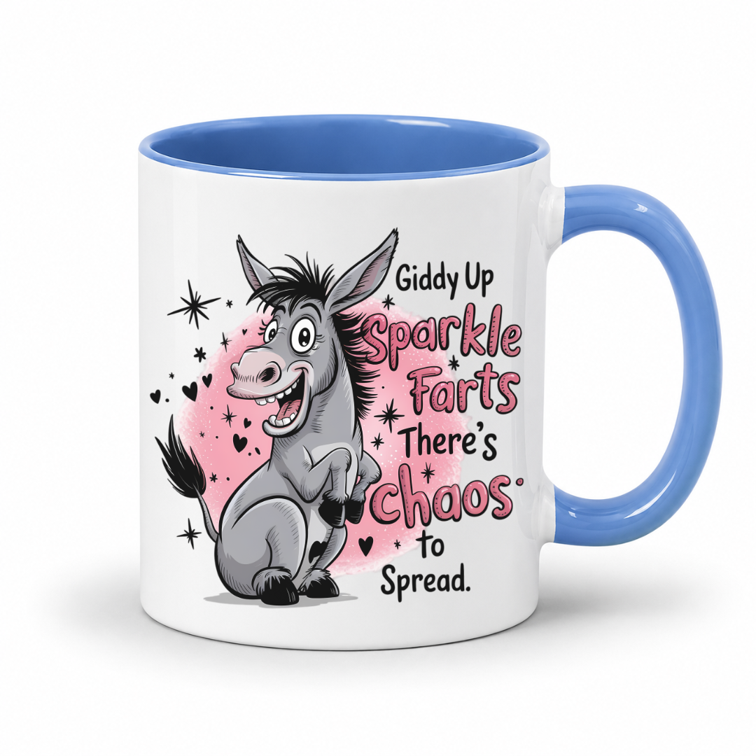 A white ceramic mug with a blue handle and blue interior, featuring a cartoon donkey illustration and the text 'Giddy Up Sparkle Farts There's Chaos to Spread' on a white background. from Coffee and Moo.