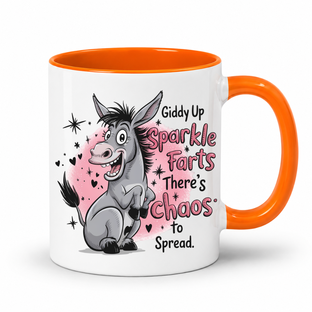 A white ceramic mug with a bright orange handle and interior, featuring a cartoon donkey illustration and the text 'Giddy Up Sparkle Farts There's Chaos to Spread.' on a clean white background. from Coffee and Moo.
