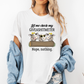 A woman wearing a white graphic t-shirt with a cow illustration and the text 'Let me check my GIVEASHITMETER Nope, nothing.' She has a light blue denim jacket draped off her shoulders and is wearing distressed jeans against a plain white background. Grab your from Coffee and Moo NZ.