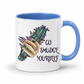 A white ceramic mug with a blue interior and handle, featuring a graphic of a tattooed hand holding a purple and green voodoo doll, next to the text 'GO SMUDGE YOURSELF' in a dark gothic font. Purchase from Coffee and Moo NZ.