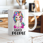 A white ceramic mug with a colorful cartoon unicorn graphic and the text 'I HATE PEOPLE' printed on the front, set on a rustic white wooden table with a blurred kitchen background. From Coffee and Moo NZ.