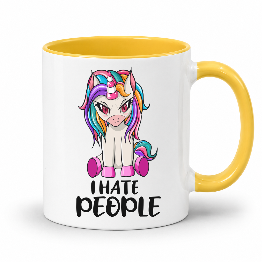 A white ceramic mug with a yellow interior and handle, featuring a cartoon unicorn graphic and the text 'I HATE PEOPLE' printed on the front, set against a plain white background. From Coffee and Moo NZ.