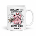 A white ceramic mug with a humorous cartoon graphic of a pink pig wearing glasses and a red headband, holding a wooden sign that says 'FUCK'. The text above and below reads 'IF SWEARING BURNED CALORIES I'D BE A SKINNY BITCH BY NOW!'. from Coffee and Moo.