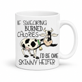 If Swearing Burned Calories I'd Be One Skinny Heifer Cow Mug showing the full cartoon cow and humorous quote design, from Coffee and Moo NZ.