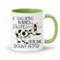 A white ceramic coffee mug with a light green interior and handle, featuring a cartoon of a black-and-white cow and the text 'IF SWEARING BURNED CALORIES I'D BE ONE SKINNY HEIFER' on a white background. purchase from Coffee and Moo NZ.