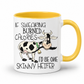 A white ceramic coffee mug with a yellow interior and yellow handle, featuring a cartoon cow and the text 'IF SWEARING BURNED CALORIES I'D BE ONE SKINNY HEIFER' on a white background. purchase from Coffee and Moo NZ.
