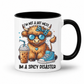 A white ceramic mug with a black interior and handle, featuring a cartoon highland cow wearing blue sunglasses and a blue bow tie, with the text 'I'M NOT A HOT MESS IM A SPICY DISASTER'. from Coffee and Moo NZ.