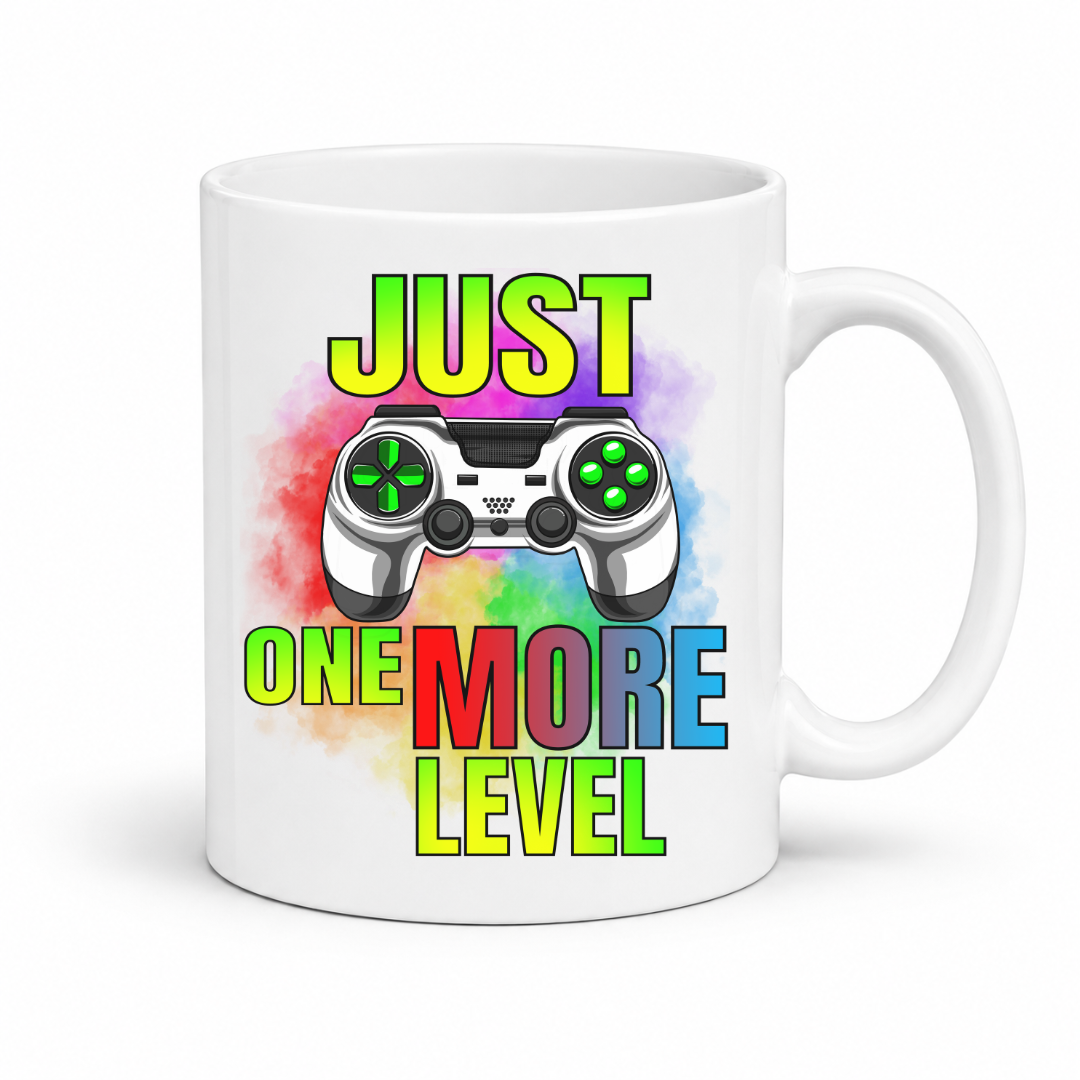 Just One More Level gaming coffee mug showing a colourful controller, rainbow watercolour background and bold "Just One More Level" design, from Coffee and Moo.