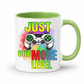 Just One More Level gaming coffee mug showing a colourful controller, rainbow watercolour background and bold "Just One More Level" design, with a green inner and handle, from Coffee and Moo.