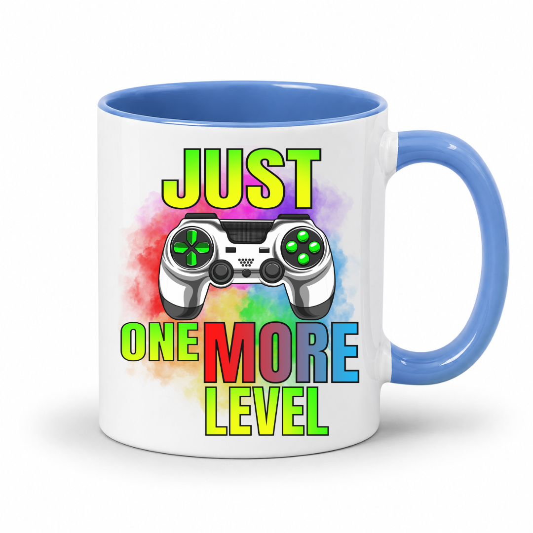 Just One More Level gaming coffee mug showing a colourful controller, rainbow watercolour background and bold "Just One More Level" design, with a blue inner and handle, from Coffee and Moo.