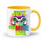 Just One More Level gaming coffee mug showing a colourful controller, rainbow watercolour background and bold "Just One More Level" design, with a yellow inner and handle, from Coffee and Moo.