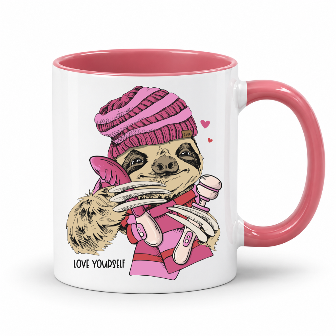 A white mug with pink inner and handle featuring  an image of a Naughty Sloth with a pink scarf holding two vibrators, with hearts and Love Yourself lettering, from Coffee and Moo.