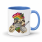 A white ceramic coffee mug with a blue handle and blue interior, featuring a colorful graphic of a sloth wearing a rainbow-striped beanie with a marijuana leaf and holding a bong & Baggy. Grab your mug from Coffee and Moo NZ.