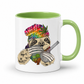 A white ceramic coffee mug with a green handle and green interior, featuring a colorful graphic of a sloth wearing a rainbow-striped beanie with a marijuana leaf and holding a bong & Baggy. Grab your mug from Coffee and Moo NZ.
