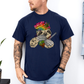 A man wearing a navy unhinged adult graphic tee features our resident zen master—a delightfully baked sloth rocking a vibrant, colourful tie-dye beanie topped with a cannabis leaf, proudly clutching a bong and a jar of premium green buds. Grab your sloth stoner tee from Coffee and Moo NZ.