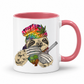 A white ceramic coffee mug with a pink handle and pink interior, featuring a colorful graphic of a sloth wearing a rainbow-striped beanie with a marijuana leaf and holding a bong & Baggy. Grab your mug from Coffee and Moo NZ.