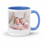 A white ceramic mug with a blue interior and blue handle, featuring a printed custom photo of three children. Grab your custom photo mug from Coffee and Moo NZ.