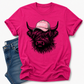 A bright pink short-sleeve t-shirt with a graphic of a shaggy Highland cow wearing a pink cap that says 'BOSSY' in white letters. The t-shirt is styled flat-lay with a pair of blue jeans on a clean white background.  Grab your tee from Coffee and Moo NZ.