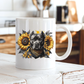 A white ceramic mug featuring a graphic print of a black pitbull dog wearing a bandana, surrounded by yellow sunflowers, set on a rustic white wooden table in a blurred kitchen background. Grab your mug from Coffee and Moo NZ.