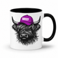 A white ceramic mug with a black interior and handle, featuring a graphic of a shaggy Highland cow wearing a purple cap with the word 'BOSSY' in white letters. Grab your bossy highland coo mug from Coffee and Moo NZ.