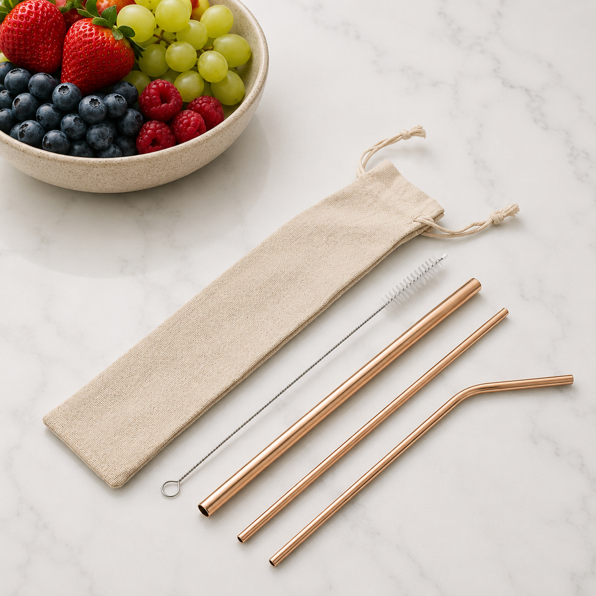 Rose gold reusable stainless steel straw set with straight, bent and smoothie straws, cleaning brush and drawstring pouch. from coffee and moo nz