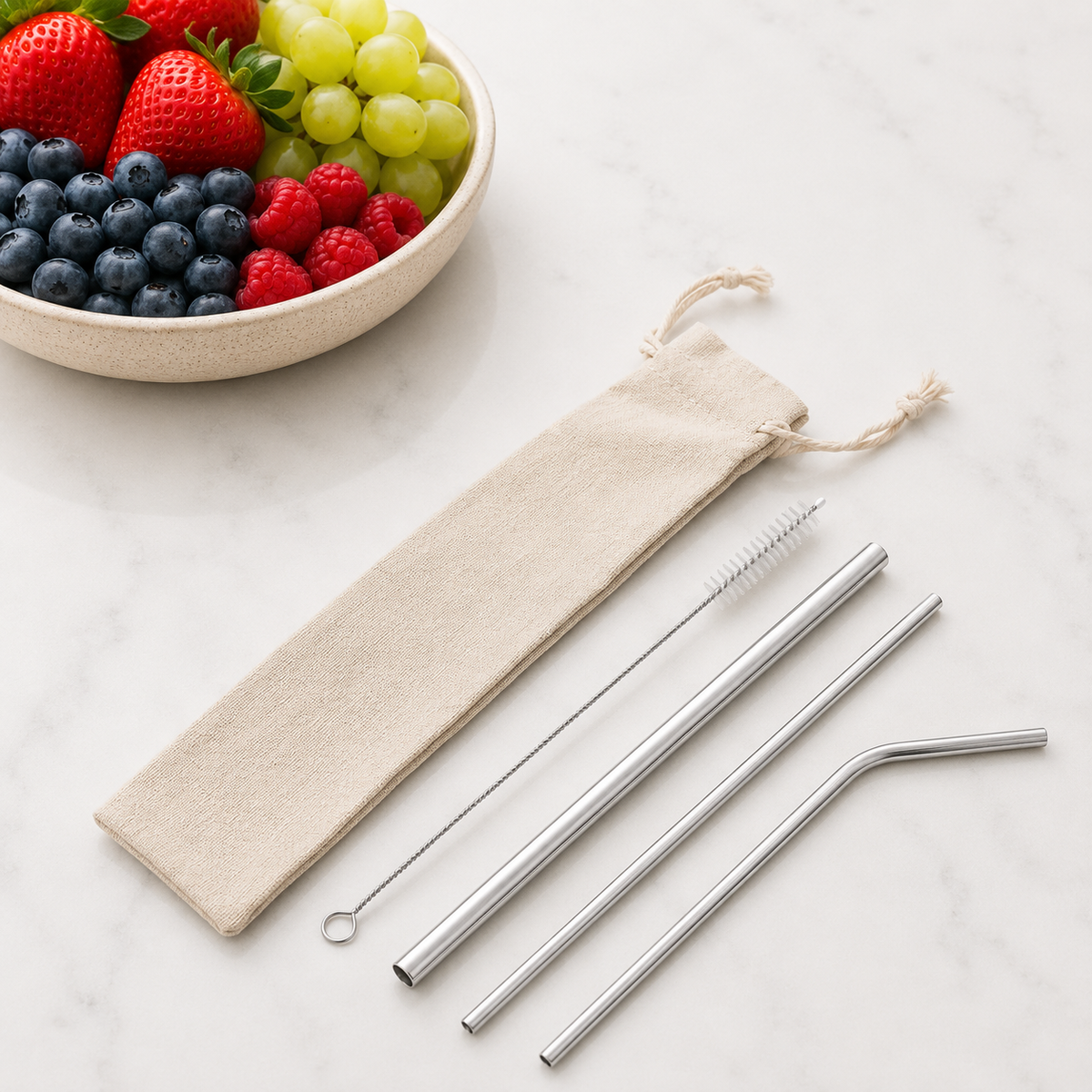 Silver reusable stainless steel straw set featuring three different straws, cleaning brush and beige drawstring pouch. from coffee and moo nz