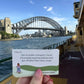 The Getting Lost Solo Adventurers Edition is your ultimate permit to escape the noise, skip the group compromises, and explore the world entirely at your own pace.  The card reads, 'Getting Lost' with a small illustration of a girl walking on green hills. Grab your game from Coffee and Moo NZ