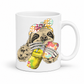 A white ceramic mug with a colorful illustration of a sloth wearing a polka-dot bow bandana and holding a loaded-tea drink and a phone, set on a  white  background. Grab yours from Coffee and Moo NZ.
