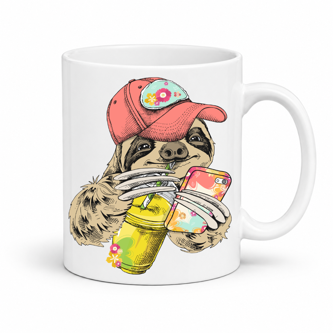 A white ceramic mug with a colorful illustration of a sloth wearing a coral coloured cap and holding a loaded-tea drink and a phone, set on a  white  background. Grab yours from Coffee and Moo NZ.