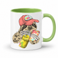 A white ceramic mug with a green interior and green handle, with a colorful illustration of a sloth wearing a coral coloured cap and holding a loaded-tea drink and a phone, set on a  white  background. Grab yours from Coffee and Moo NZ.