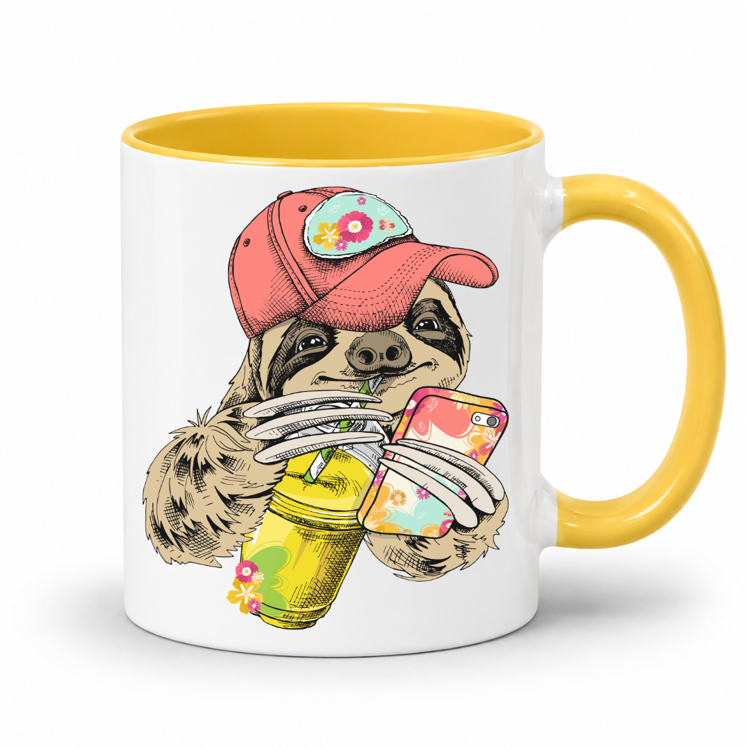 A white ceramic mug with a yellow interior and yellow handle, with a colorful illustration of a sloth wearing a coral coloured cap and holding a loaded-tea drink and a phone, set on a  white  background. Grab yours from Coffee and Moo NZ.
