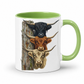 A white ceramic mug with a light green interior and handle, featuring a graphic print of three Scottish Highland cattle heads stacked vertically next to a weathered wooden post.  From Coffee and Moo NZ
