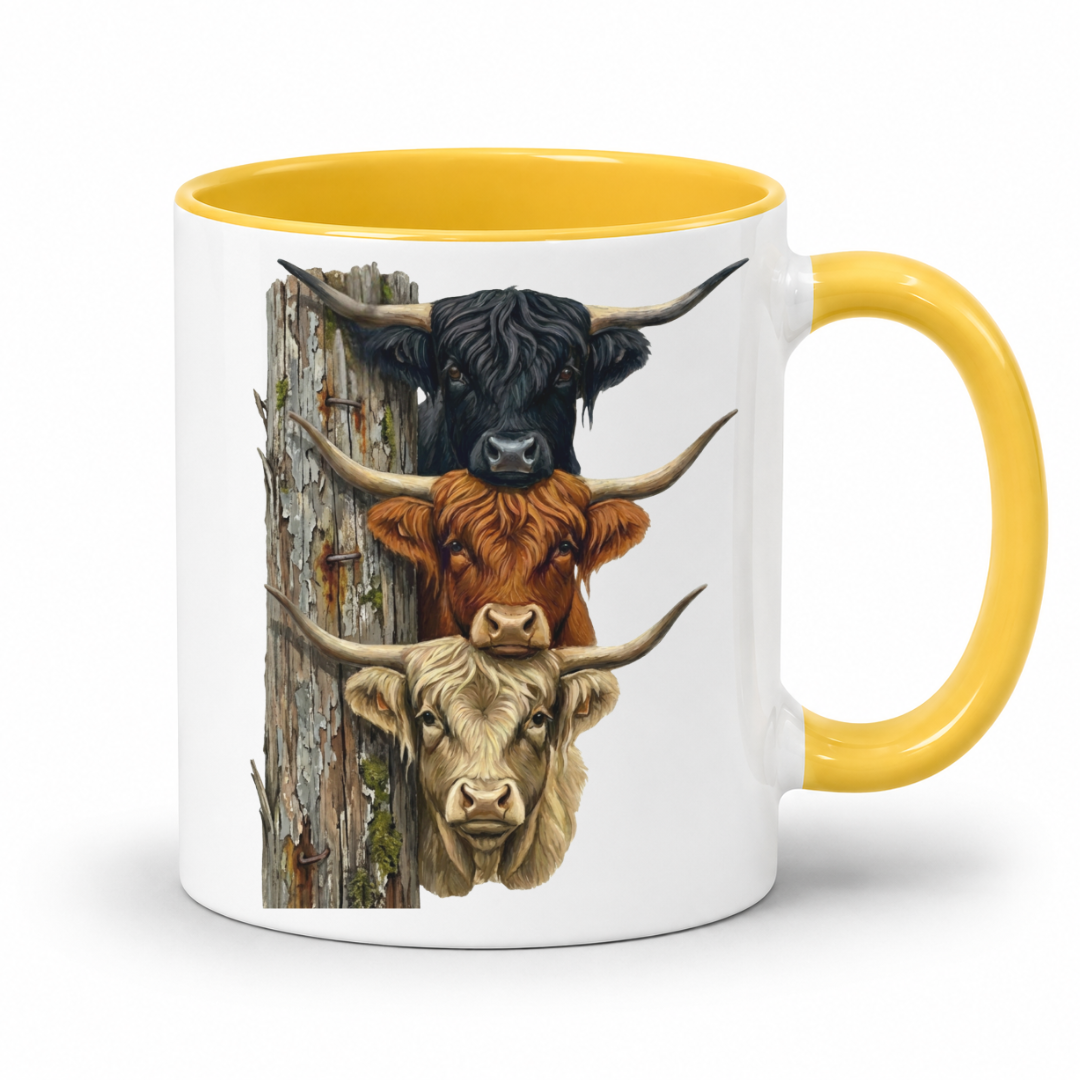 A white ceramic mug with a yellow interior and handle, featuring a printed graphic of three Highland cows stacked vertically next to afarm post.  From Coffee and Moo NZ.