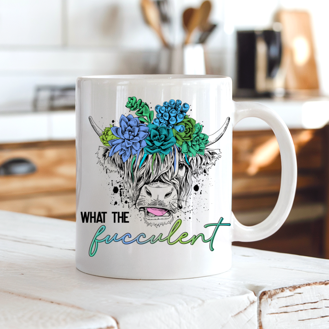 What the Fucculent Highland Cow Coffee Mug on a country kitchen bench, adding humour to a rustic setting, by Coffee and Moo NZ.