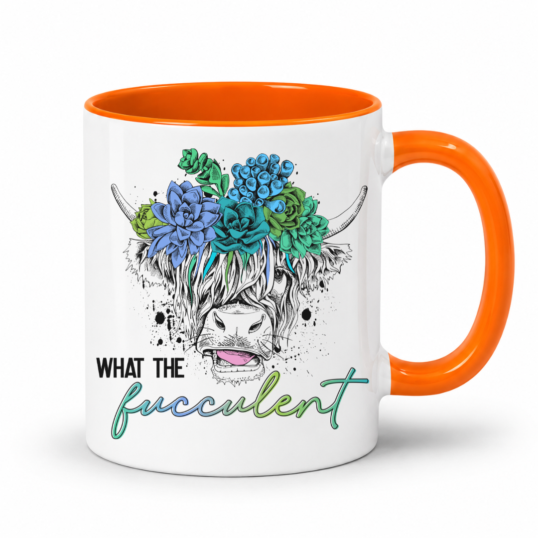A white ceramic coffee mug with a bright orange handle and interior, featuring a graphic of a highland cow's face decorated with blue and green succulents, and the text 'WHAT THE fucculent' printed below. from Coffee and Moo NZ.